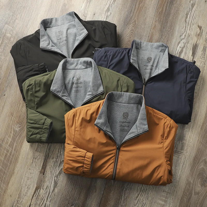Men's casual jacket with stand collar in polyester fibre and cotton blend, available in black, blue, army green and orange colours, regular fit for daily wear with sizes from M to 4XL, Asian sizing.