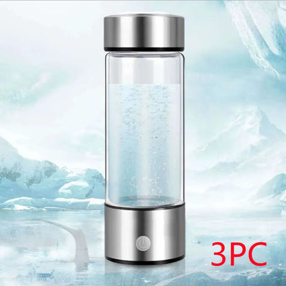 Portable hydrogen water bottle with glass chamber and stainless steel components showing electrolysis bubbles