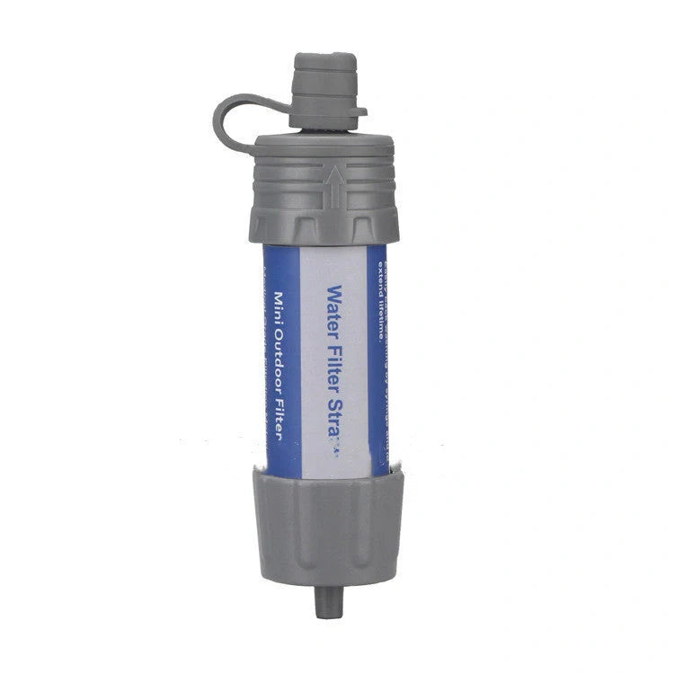 Compact portable water purifier straw with filter for outdoor adventures and emergencies.