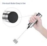 Silver handheld electric milk frother with detachable stainless steel whisk head