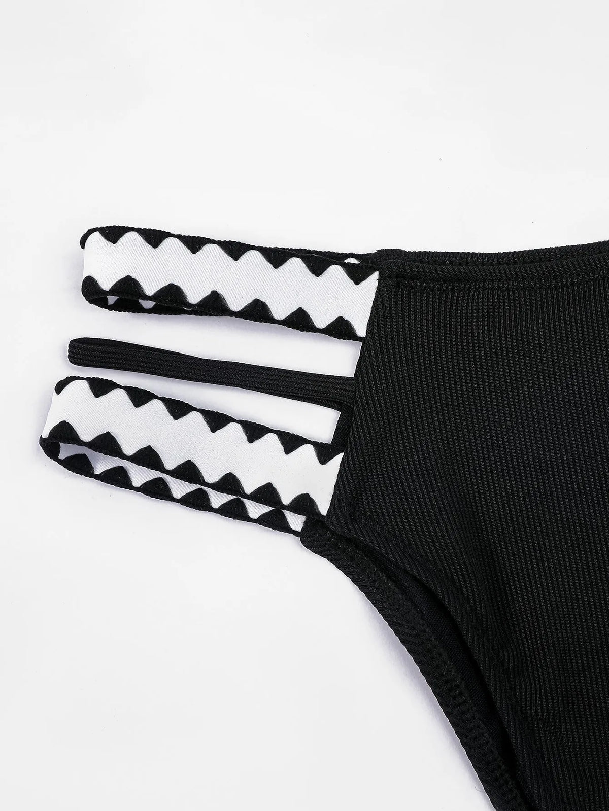 Black women's hollowed-out split swimsuit bikini set on a model.
