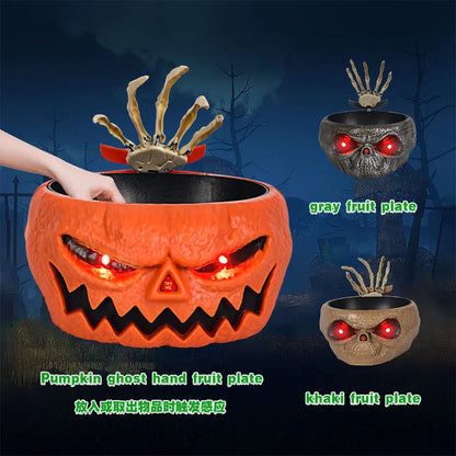 Motion-activated Halloween pumpkin candy bowl with lighted red eyes and skeleton hand in grey colour