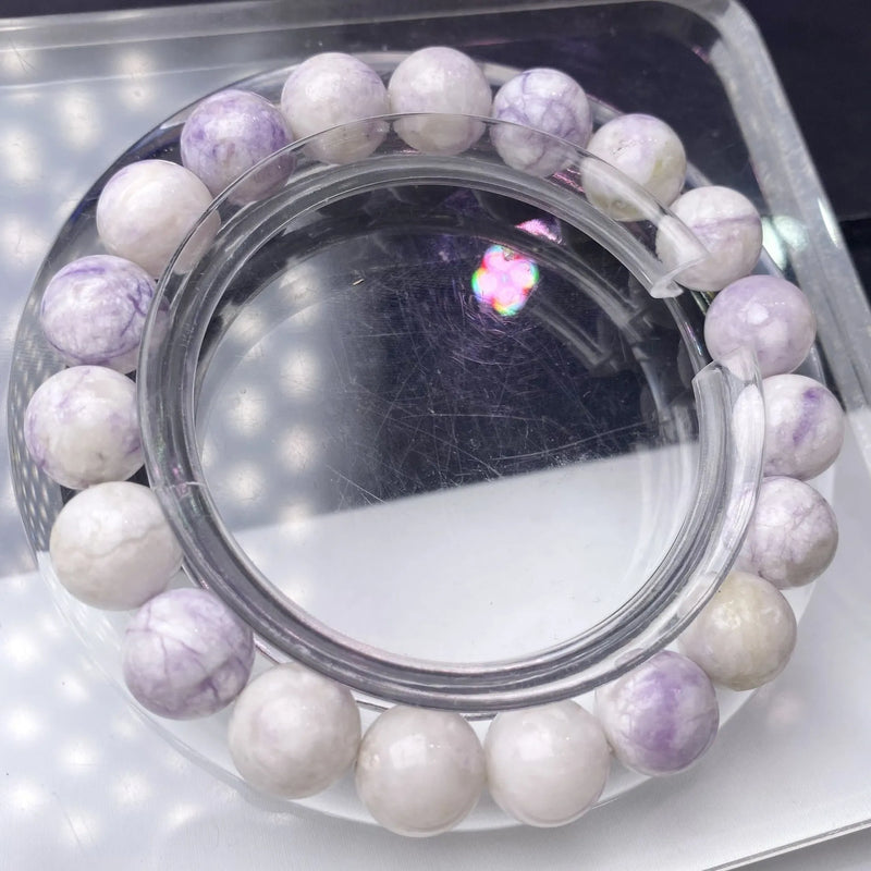 Women's bracelet in natural purple turquoise gemstone beads, handmade with adjustable leather cord closure, available in three bead sizes: approximately 6mm, 8mm, and 10mm per bead for a personalised fit and look.