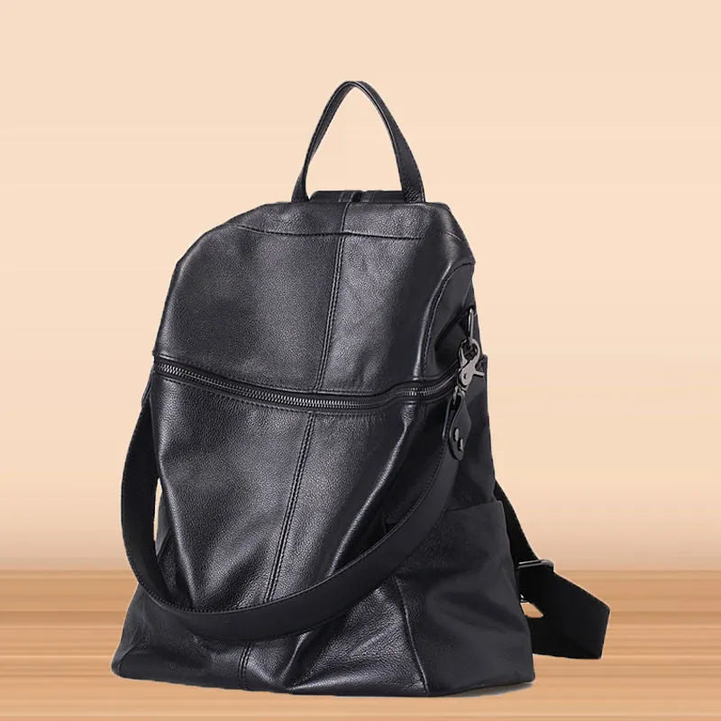 Genuine leather women's backpack with large capacity, available in two sizes and featuring waterproof construction with European and American retro style, including internal organisation for daily essentials