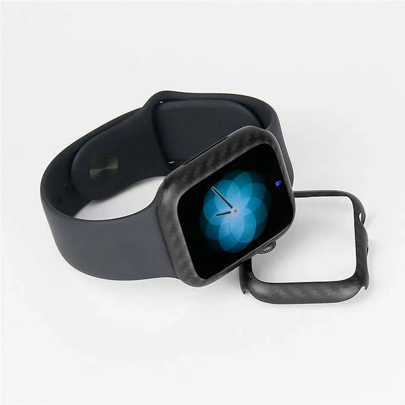 Apple Watch Series 4 in a black carbon fibre case with a leather half-wrap on a wrist