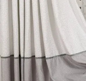 A single blackout curtain panel hanging, demonstrating its dense, light-blocking fabric and neat drape.