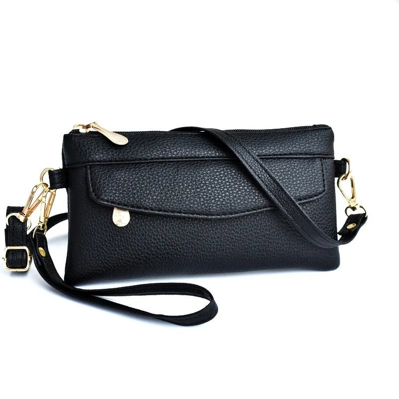 Soft surface square PU crossbody bag and clutch with internal zipper pocket in various colours.