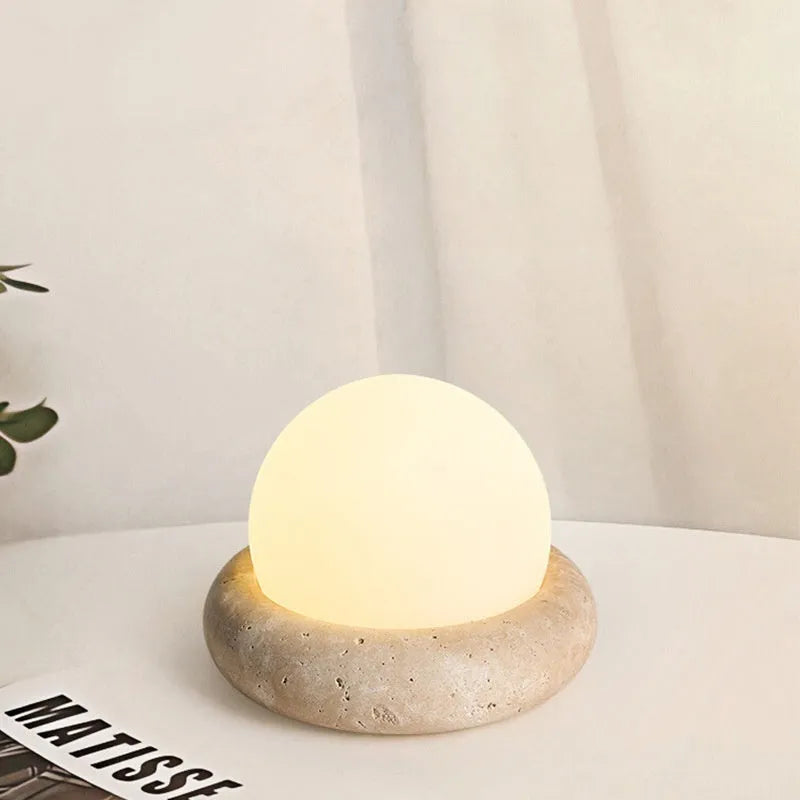 Cream coloured bedside night lamp with remote control measuring 15.5cm diameter