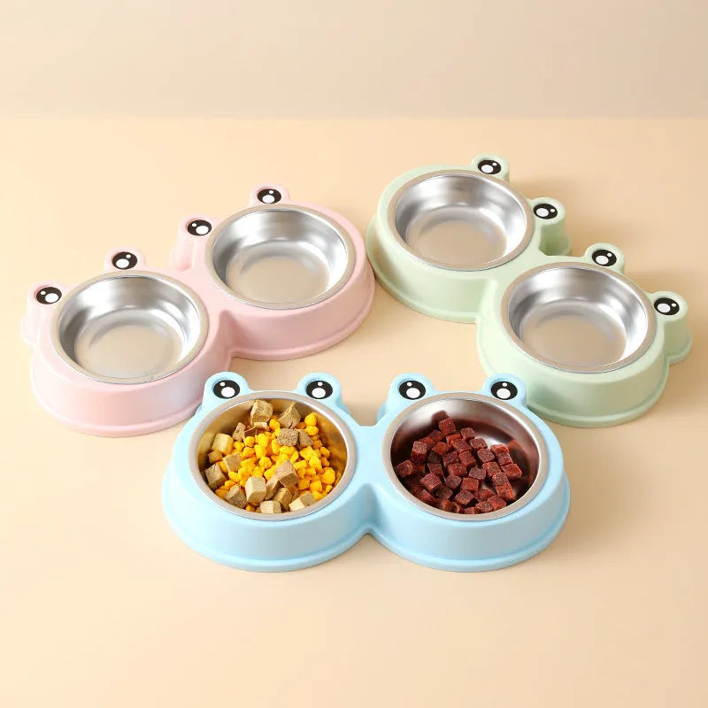 Stainless steel pet bowl with frog design and two compartments for food and water.