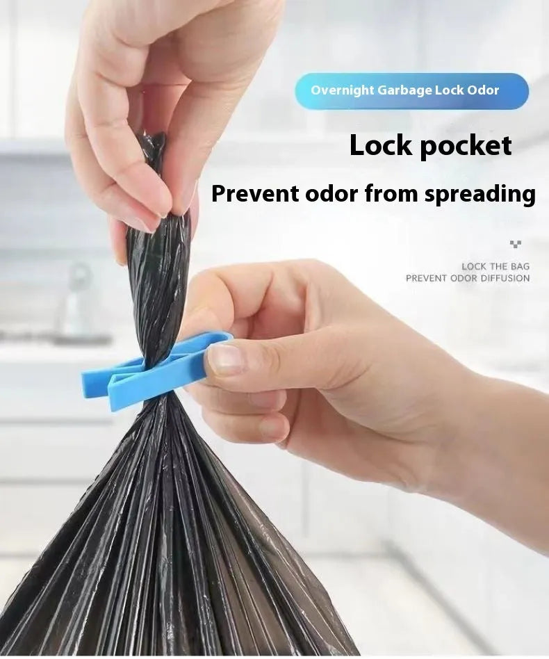 A white polypropylene plastic clip for holding a rubbish bag onto the rim of a bin.