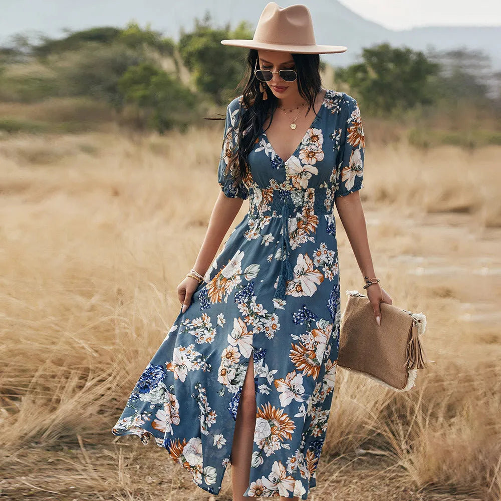 Floral summer beach dress with V-neck, elastic waist, and large hemline in mid-length design