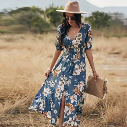 Floral summer beach dress with V-neck, elastic waist, and large hemline in mid-length design