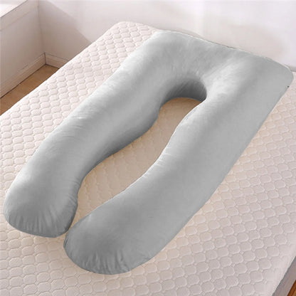 Light blue U-shaped ice silk maternity pillow for pregnancy support on a bed