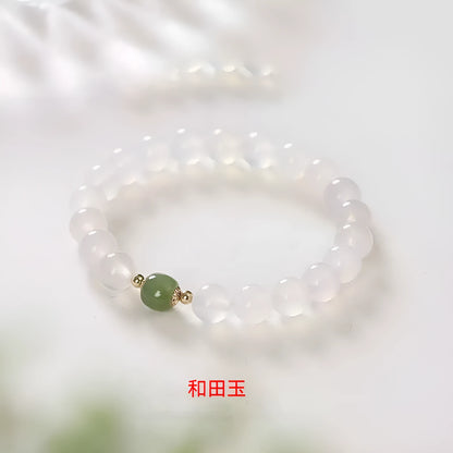 Handmade white agate and crystal bracelet with cinnabar inlay, showing 6mm or 8mm bead options.