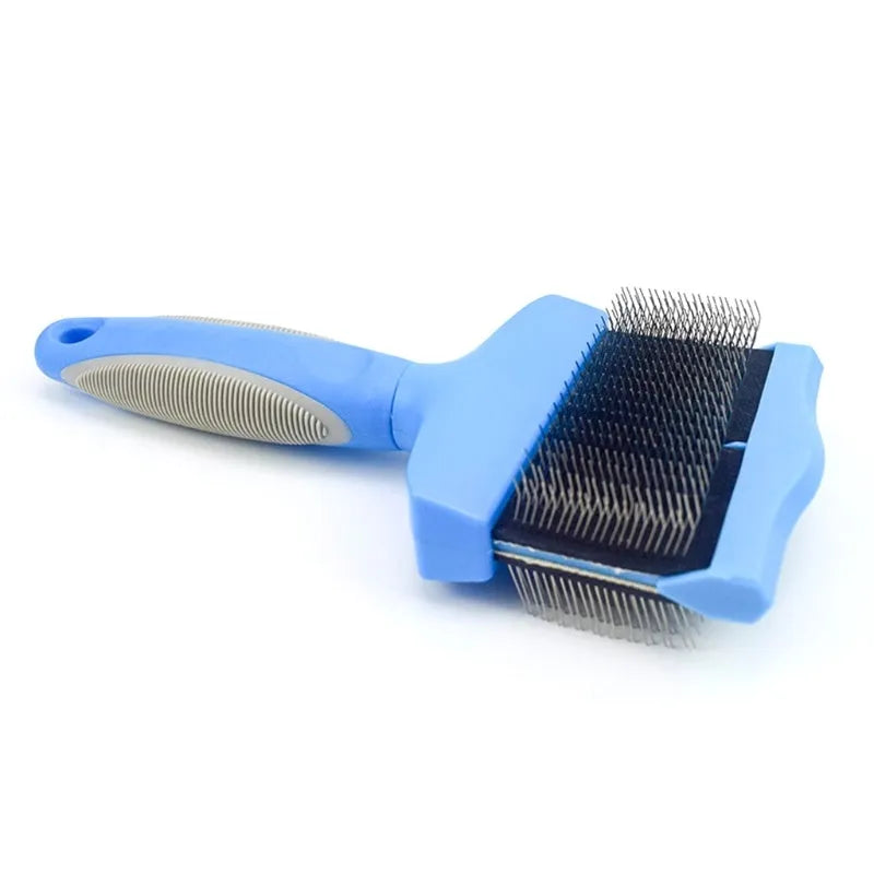 Blue double-sided pet brush for dogs and cats with stainless steel pins on a wooden table