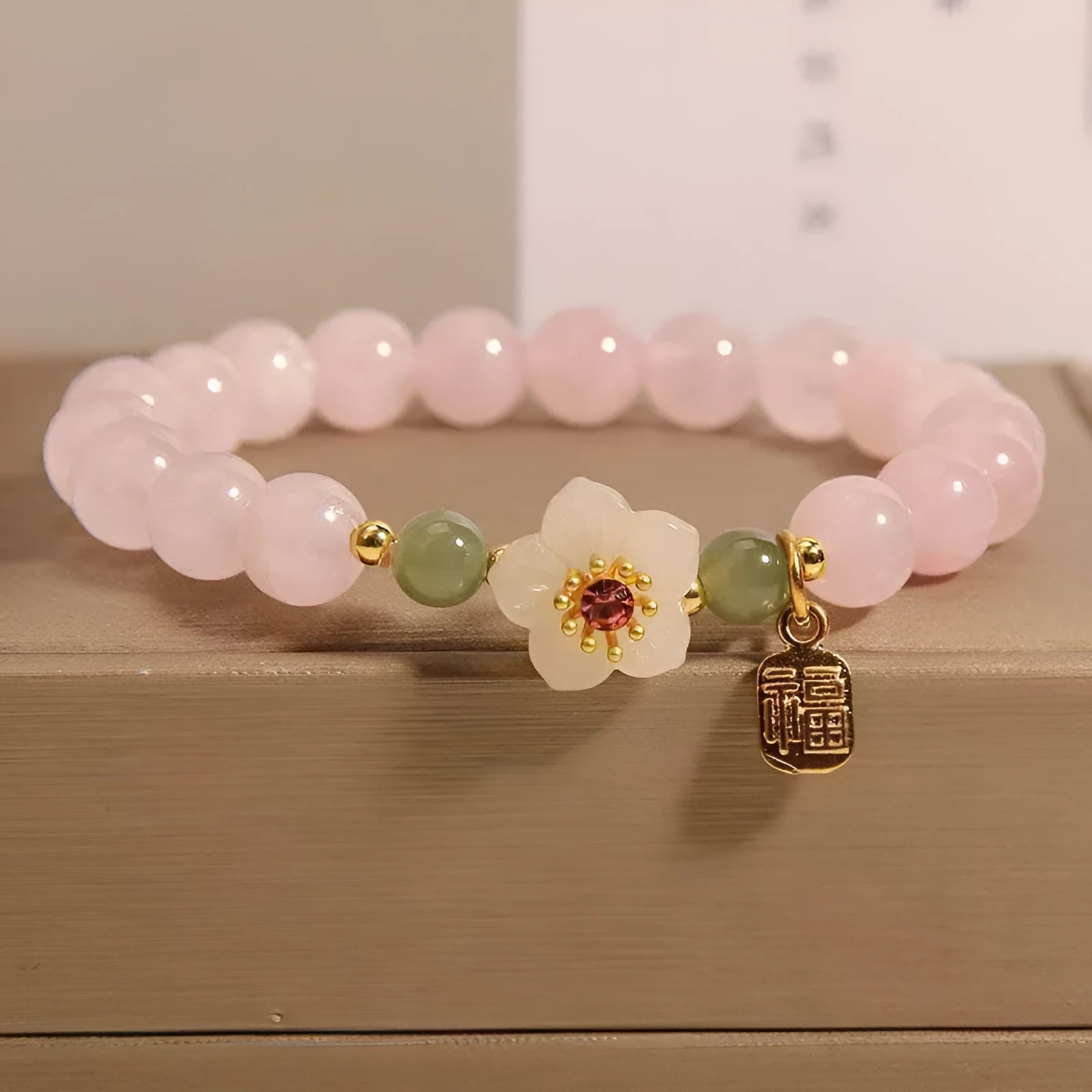 Crystal bracelet with Hetian jade elements and peach blossom design in blessing card colour