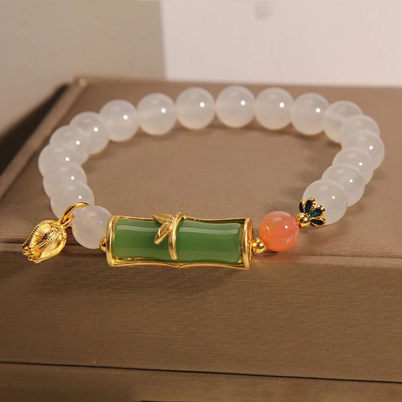Women's white agate and jade bamboo bead bracelet in retro Chinese style.