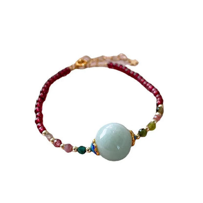 Women's garnet bracelet with aquamarine tourmaline drop charm and electroplated finish