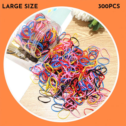 Assorted colourful thin TPU baby hair ties for toddlers and kids in a reusable plastic storage container.