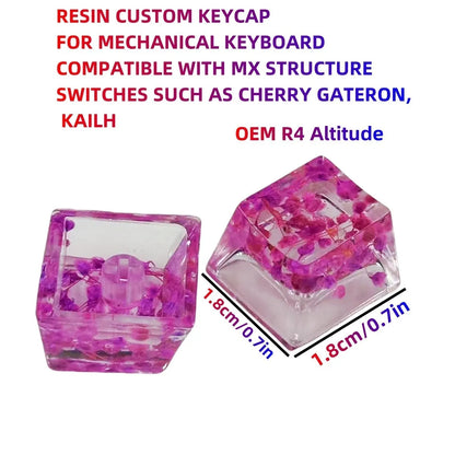 Transparent resin mechanical keyboard keycap with glitter starry sky effect in red, pink, green, or violet.