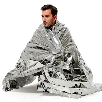 Portable double-sided silver emergency thermal blanket for outdoor adventures and survival situations