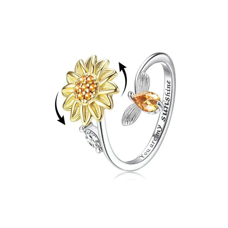 Adjustable spinner ring with rotating floral, geometric, and nature-inspired motifs for women's fashion and stress relief