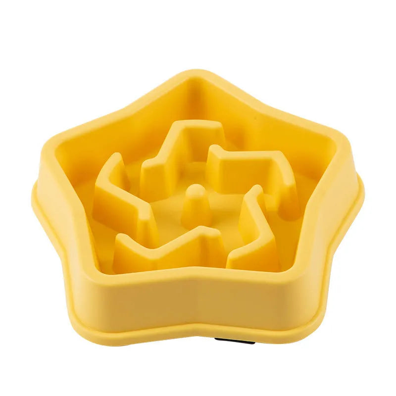 Yellow plastic slow feeding dog bowl with raised obstacles at base to prevent choking