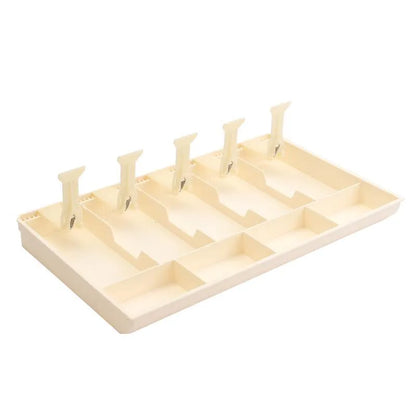 Black and white five-drawer ABS plastic cash register box for organising banknotes and coins.