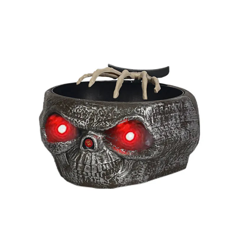 Motion-activated Halloween pumpkin candy bowl with lighted red eyes and skeleton hand in grey colour