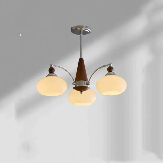 Persimmon glass chandelier with chrome frame in Middle Ancient style, shown with multiple glass shades.