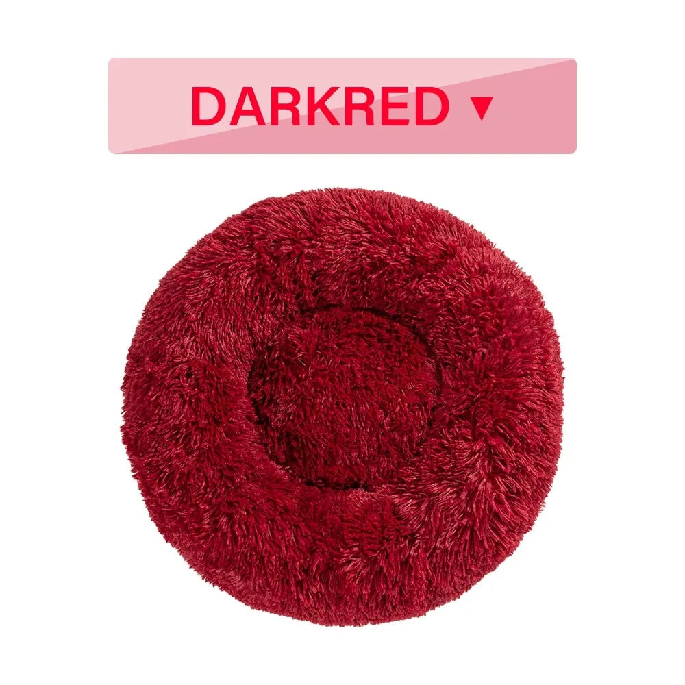 Fluffy donut-shaped pet bed with raised bolster edge in long plush material