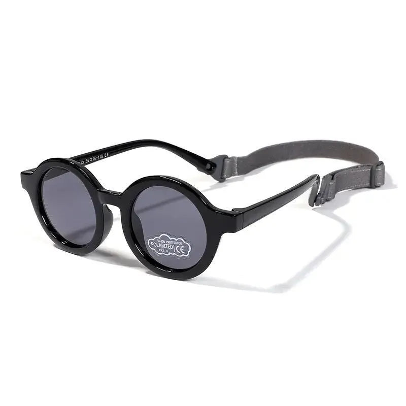 Children's round-frame polarised sunglasses with soft TPEE frame for ages 0-3, shown in assorted colours.