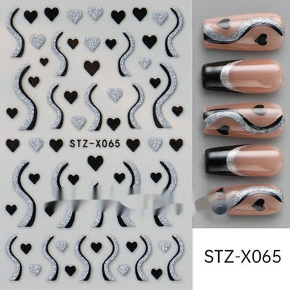 Assortment of black and silver nail sticker designs including cartoon and French tip patterns on a plastic sheet.