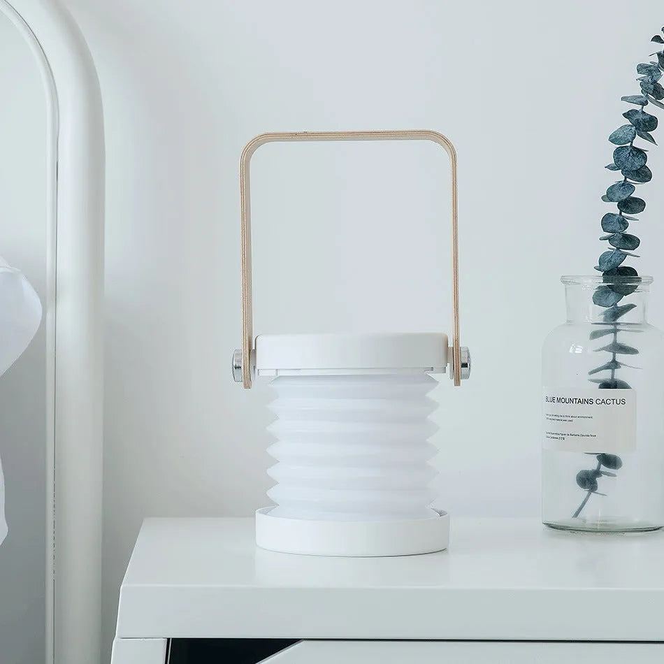 Foldable touch dimmable LED night light showing table lamp and lantern configurations