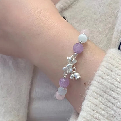 Lavender amethyst opal bracelet with crystal bowknot charm measuring 10mm