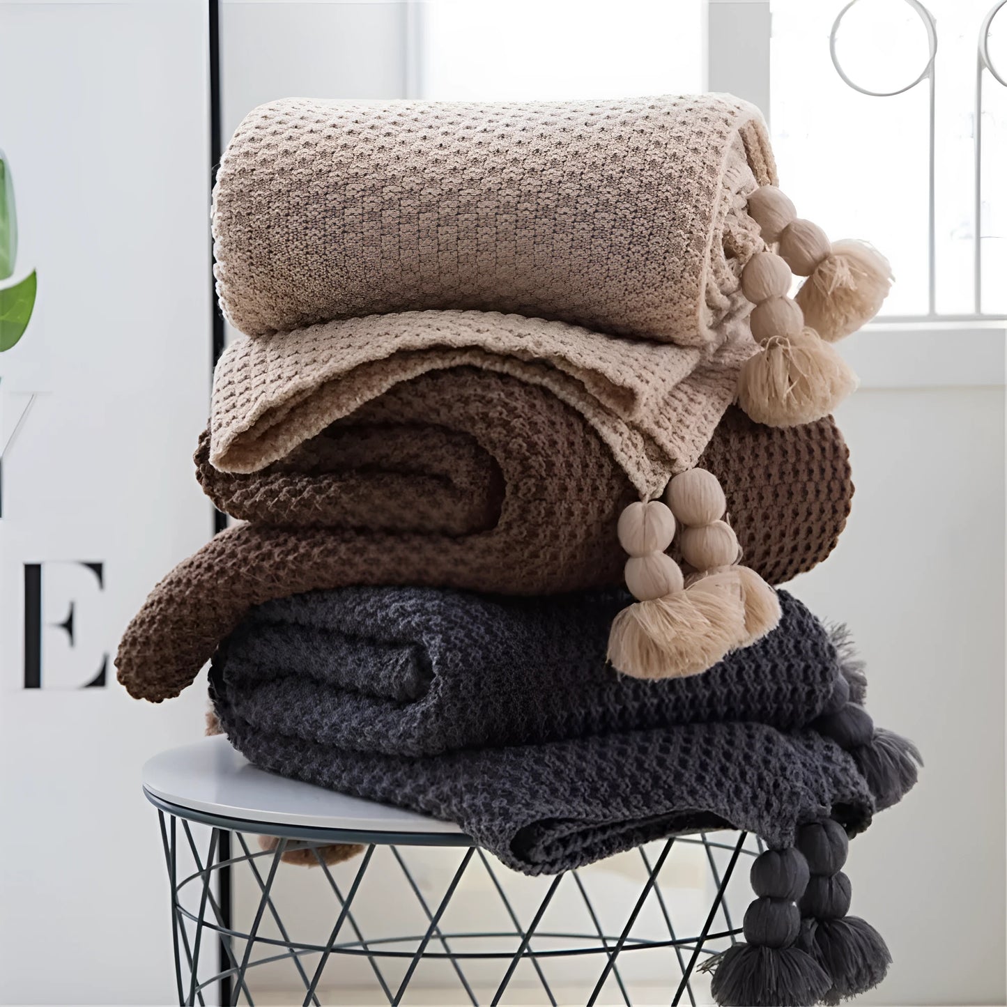 Nordic fringed knit ball acrylic blanket in beige colour measuring 130×170cm