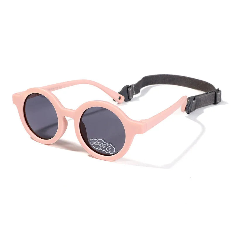 Children's round-frame polarised sunglasses with soft TPEE frame for ages 0-3, shown in assorted colours.