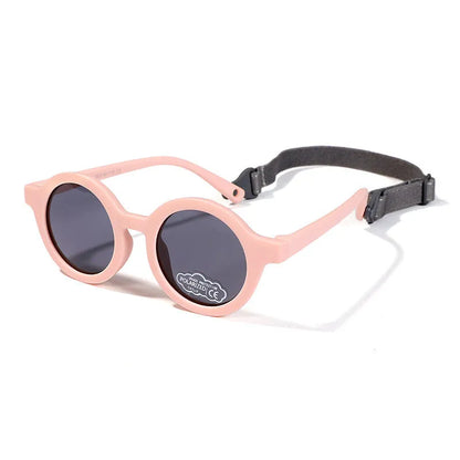 Children's round-frame polarised sunglasses with soft TPEE frame for ages 0-3, shown in assorted colours.