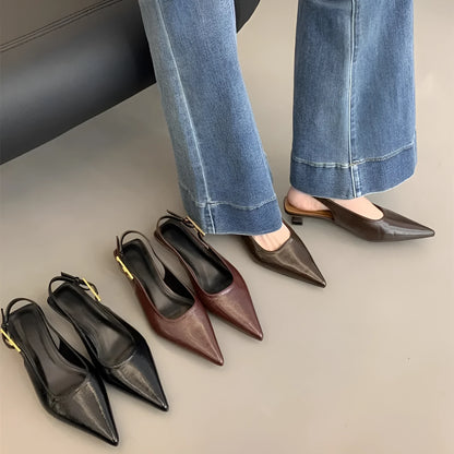 Women's black leather pointed toe shoes with low heel and thin strap.