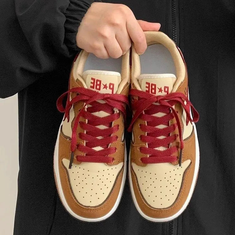 Brown women's low-top platform sneakers with lace-up front and round toe