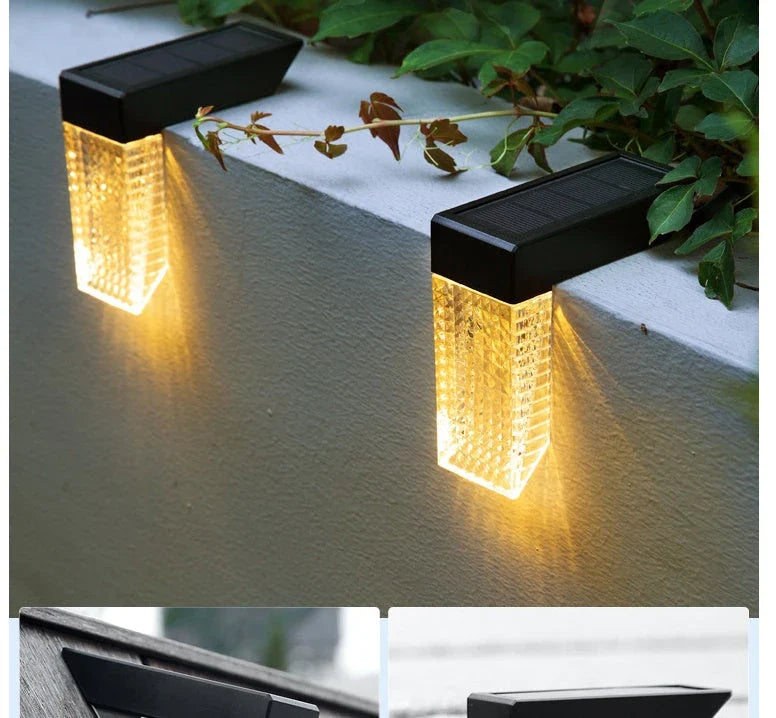 Waterproof solar-powered deck lights illuminating outdoor stairs, fence, and garden with warm, inviting glow