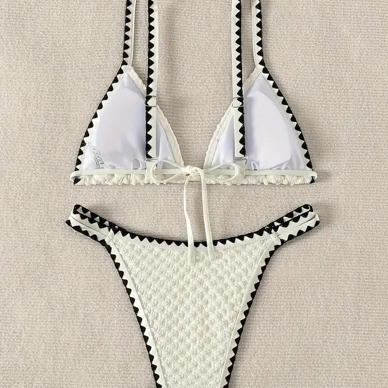 Women's blue or white two-piece bikini swimsuit with briefs style.