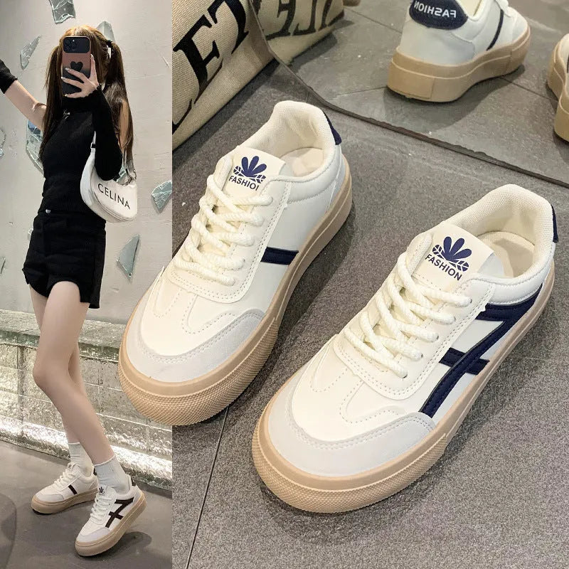 Low-top blue and brown casual lace-up shoes with round toe and flat rubber sole.