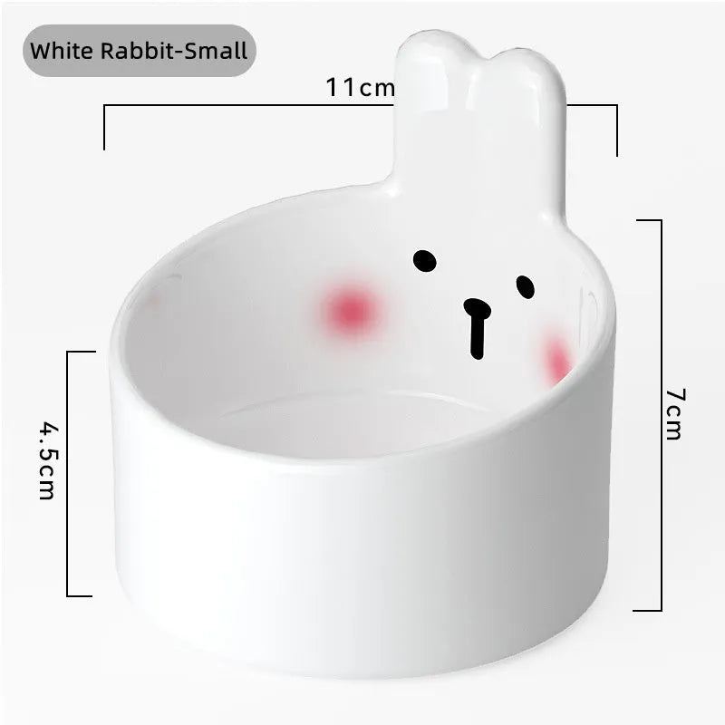 Blush Critter ceramic pet bowls in white rabbit and brown bear designs, showing neck protection rim.