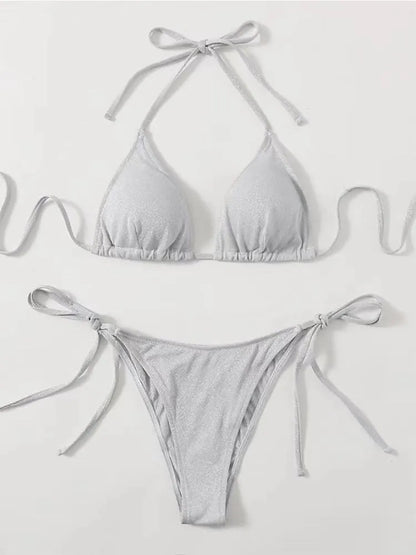 Women's khaki gold bandage bikini with adjustable straps on a beach background