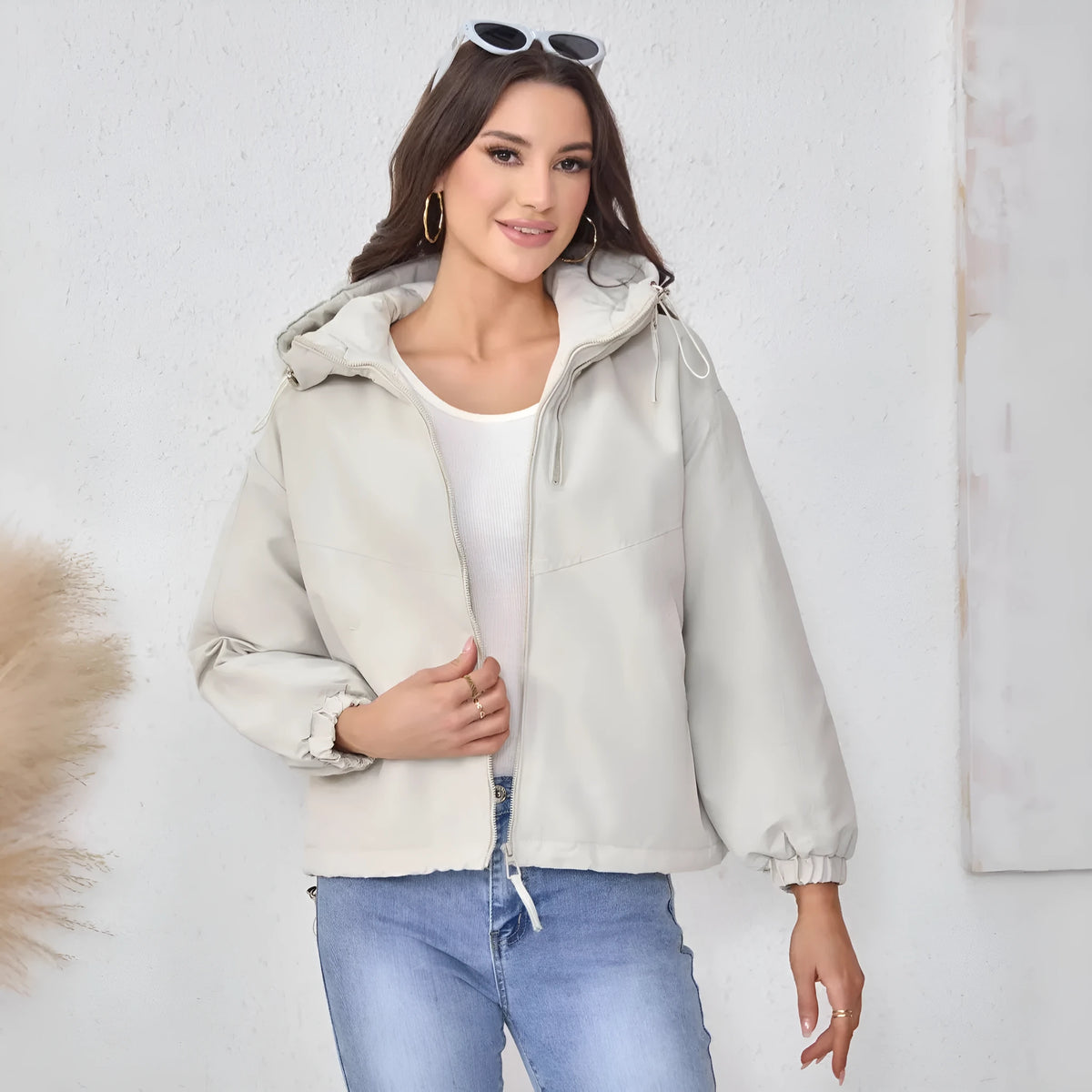 Women's loose-fit hooded shell jacket in black, grey, or purple.