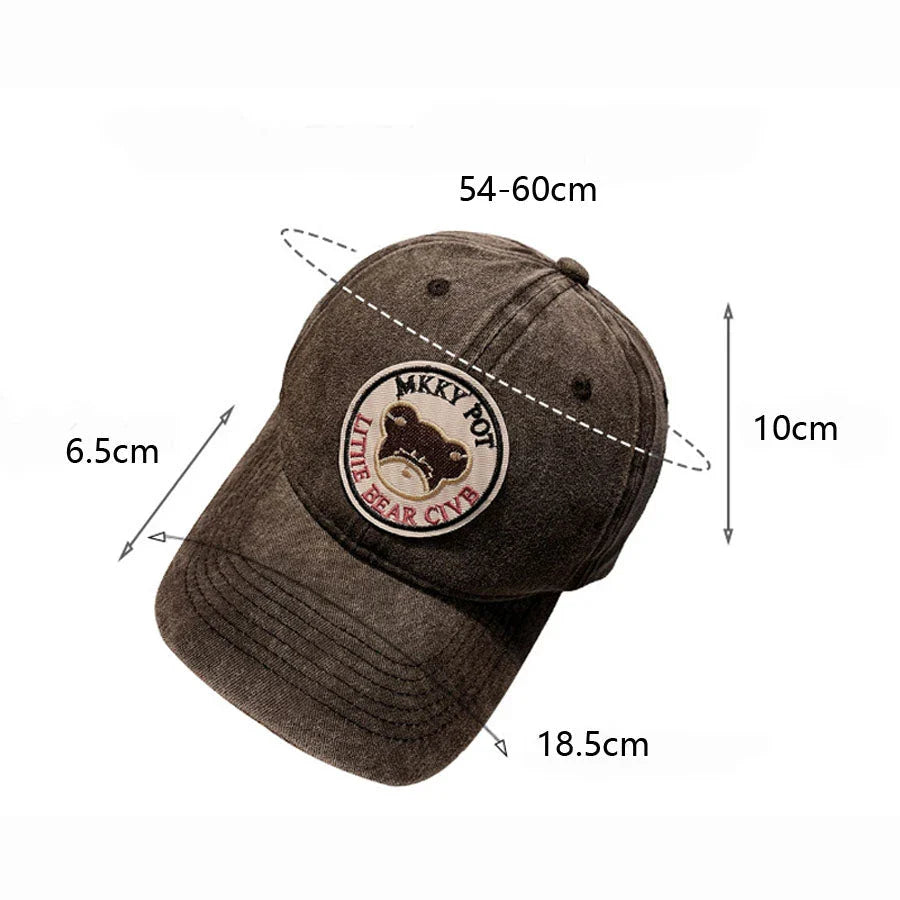 Two pink baseball caps featuring a cartoon love design, perfect for casual and festival wear