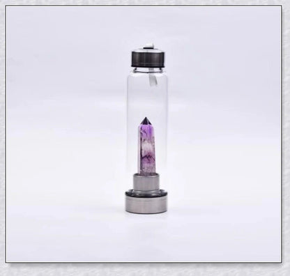 A handcrafted glass water bottle infused with natural crystals, offering a unique and sustainable hydration experience.