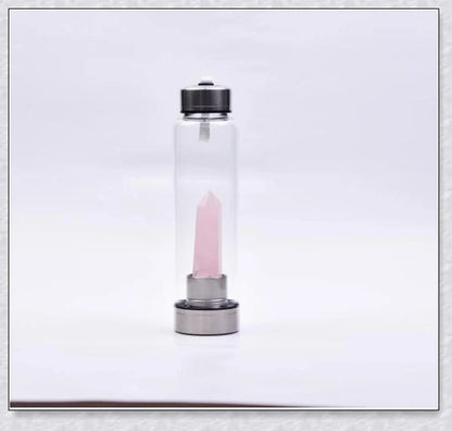 A handcrafted glass water bottle infused with natural crystals, offering a unique and sustainable hydration experience.