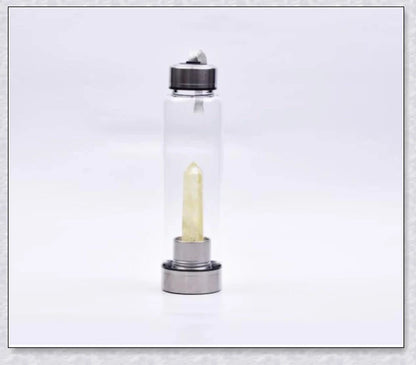 A handcrafted glass water bottle infused with natural crystals, offering a unique and sustainable hydration experience.